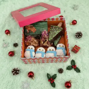Christmas hamper- with 120 gm plum cake, chocolate tree 2, snowman cupcakes 4, assorted chocolates 10